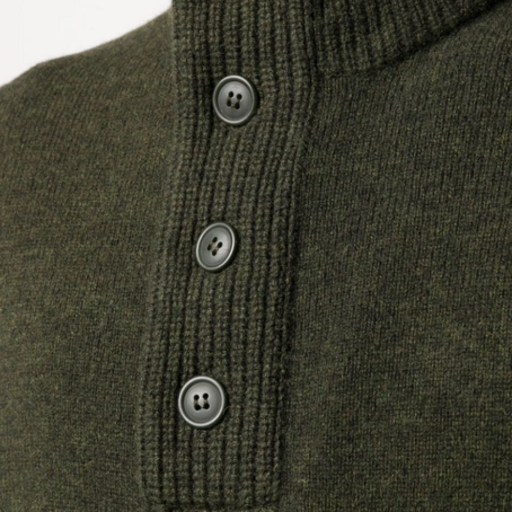 Close-up of a green knitted sweater with buttons on a white background