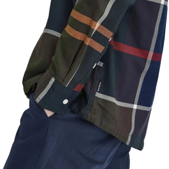 Plaid shirt with a mix of colors over a plain background