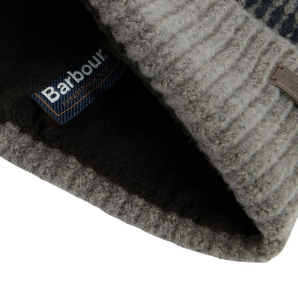 Close-up of a Barbour branded fabric with a textured pattern.