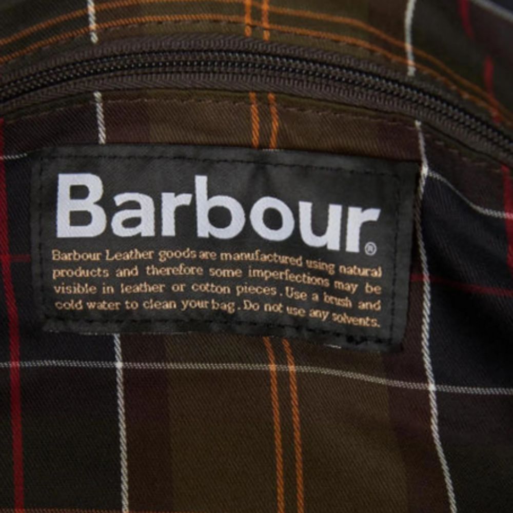 Barbour label on a plaid fabric background