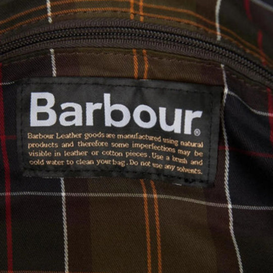 Barbour label on a plaid fabric background
