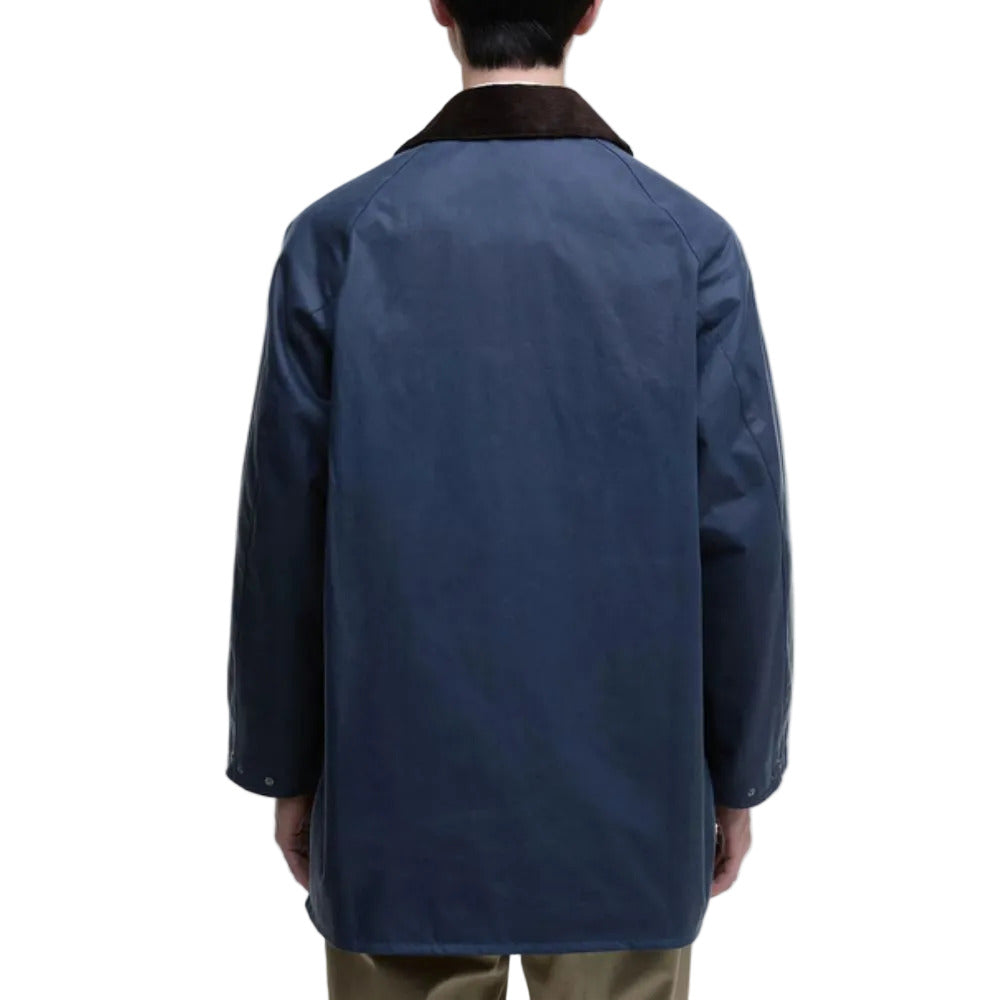 Person wearing a blue coat on a white background