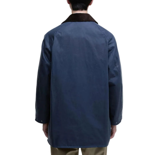 Person wearing a blue coat on a white background