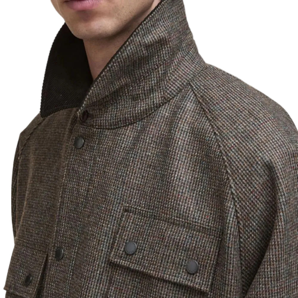 Close-up of a brown textured jacket with buttons on a white background