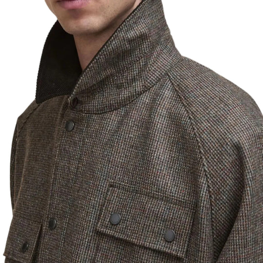 Close-up of a brown textured jacket with buttons on a white background