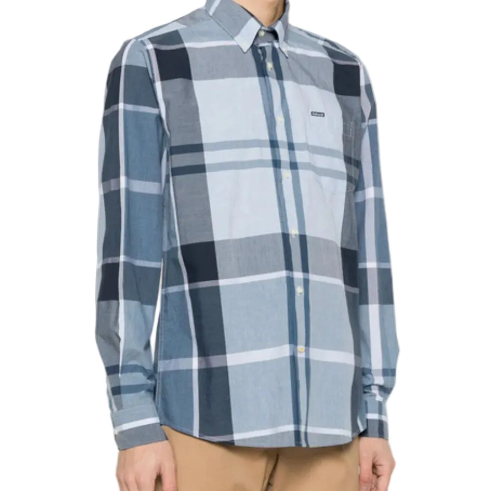 Blue and gray plaid shirt worn by a person on a white background
