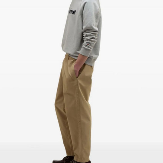 Person wearing a BARBOUR X NOAH Cotton Sweatshirt and pants on a white background. 