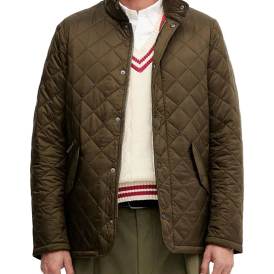 Quilted jacket worn over a sweater with a white background