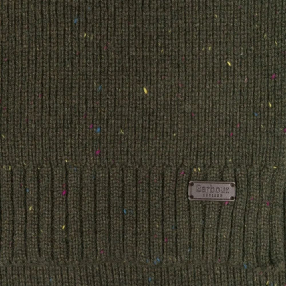 Textured green fabric with a label