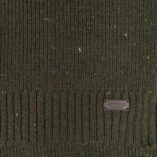 Textured green fabric with a label