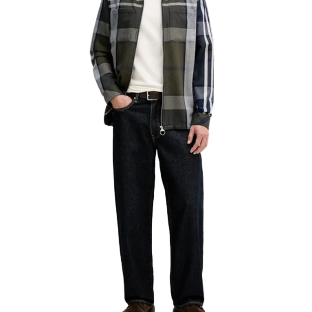 Person wearing a plaid shirt, white t-shirt, and dark jeans on a white background