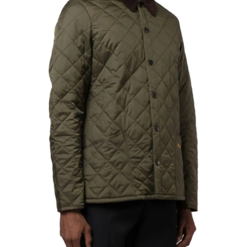 Quilted green jacket on a white background