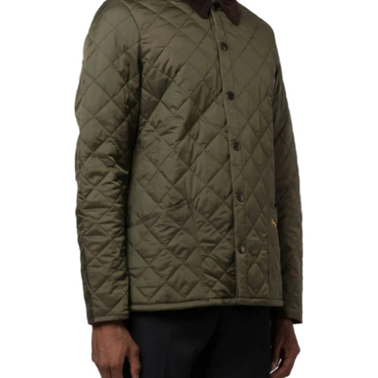 Quilted green jacket on a white background