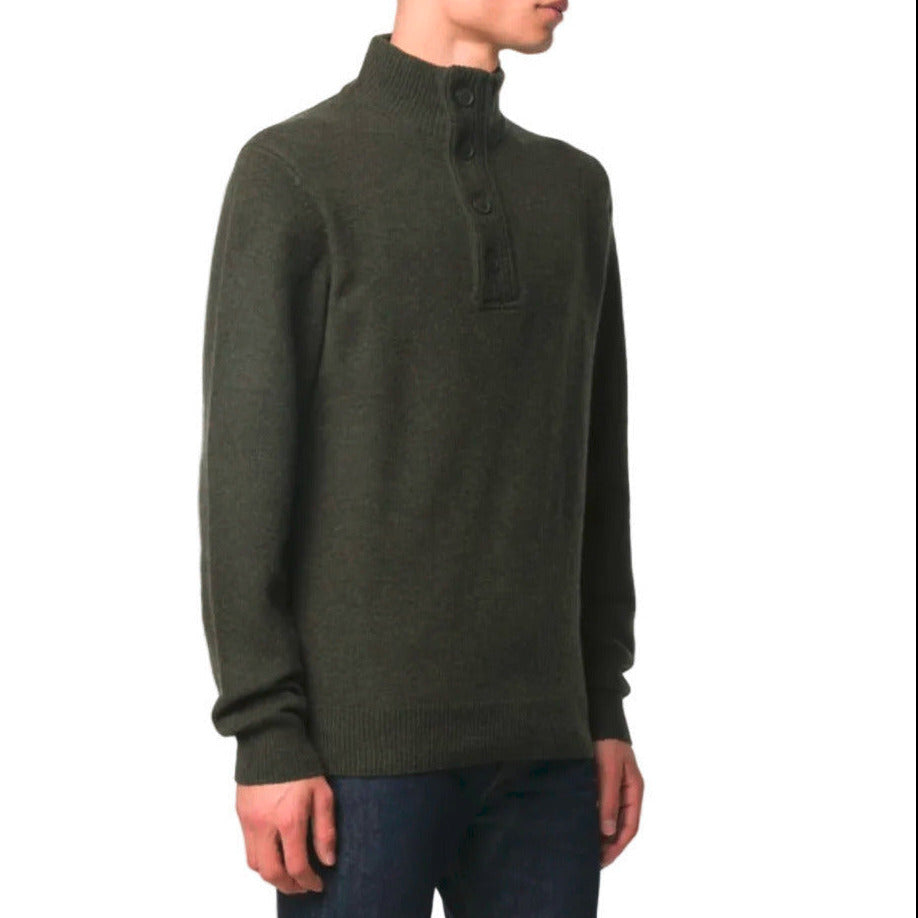 Person wearing a green sweater with a white background