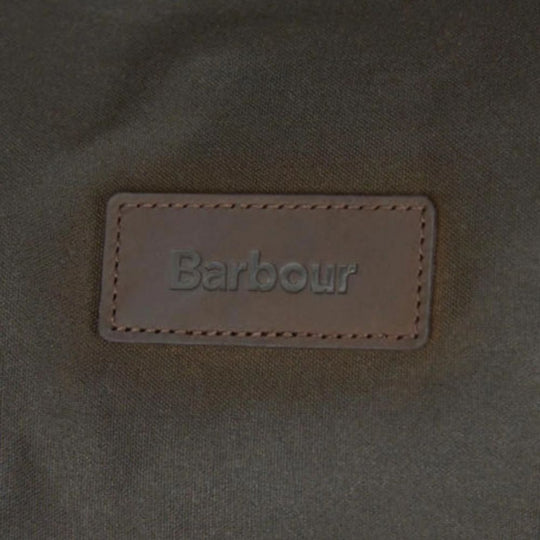 Barbour logo on a textured fabric background