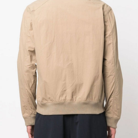 Beige bomber jacket on a plain background