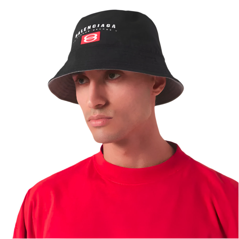 A male model wearing Balenciaga Unisex All Seasons Black Cotton Bucket Hat