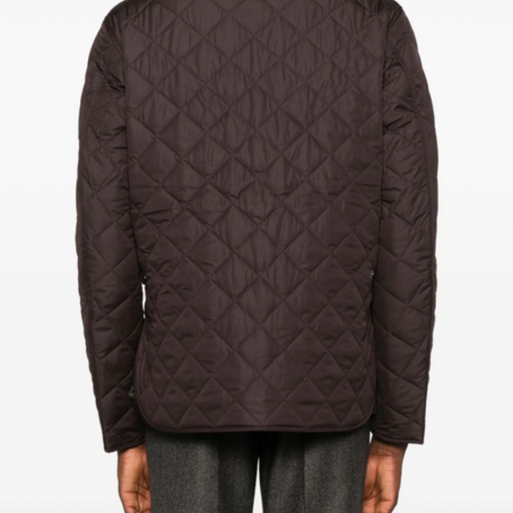 Quilted jacket with diamond pattern on a white background