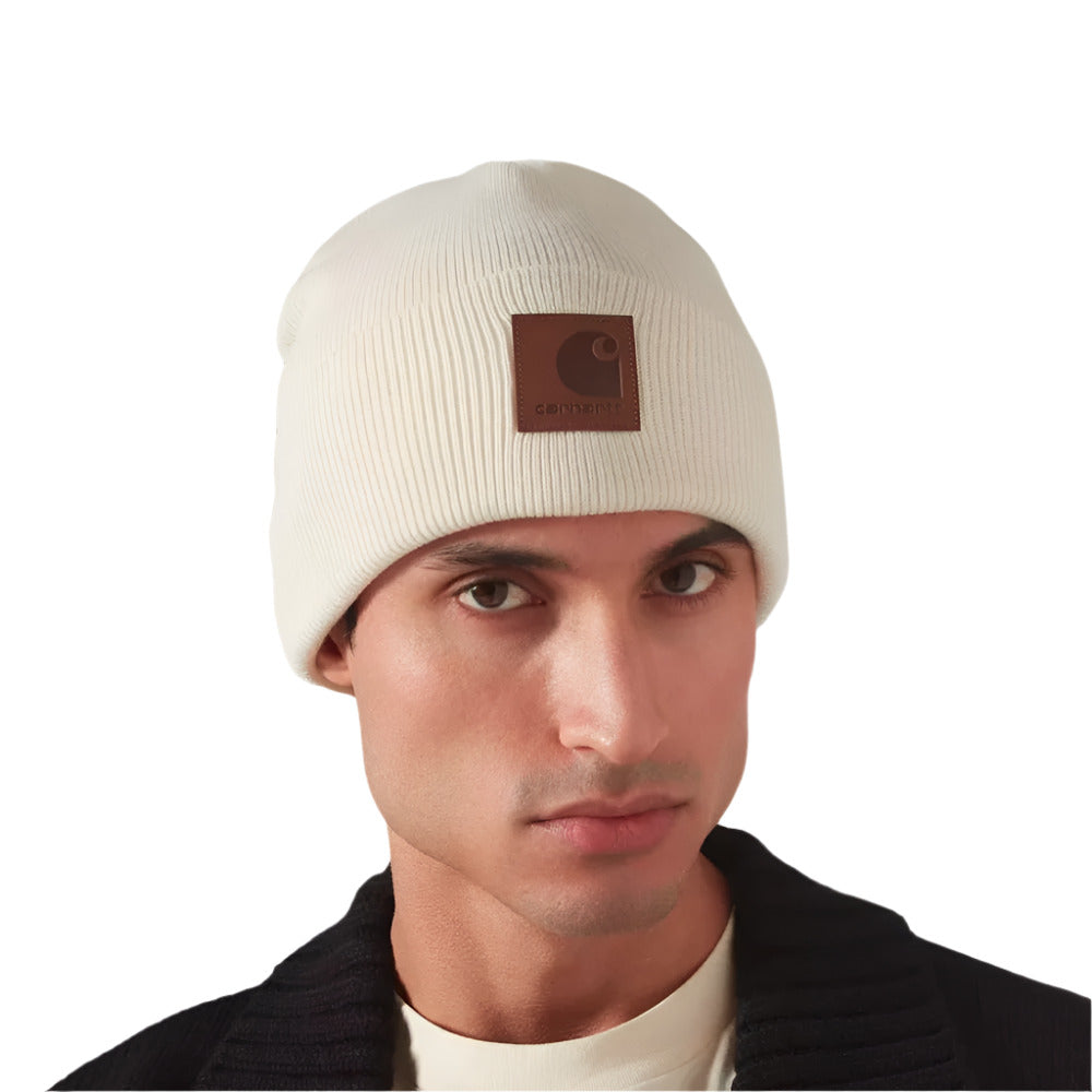 A model wearing Carhartt WIP Eldon Soft Acrylic Ribbed Knit Workwear Off White Beanie
