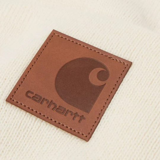 Close-up of a Off White Carhartt WIP beanie with the logo patch visible.