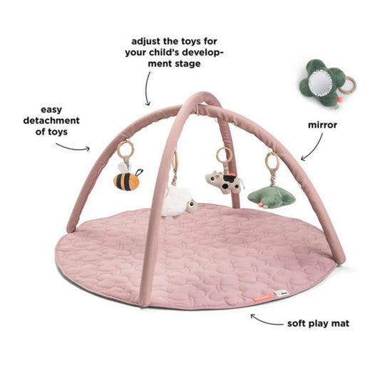 Done by Deer Pink baby play gym with attached toys on a white background