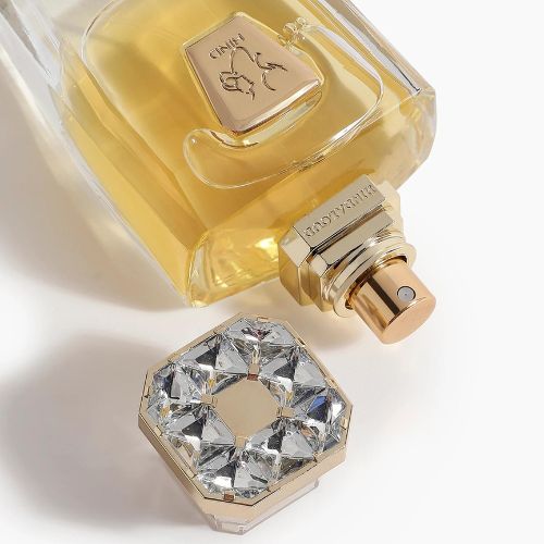 A 50mL Parfum bottle of Devotion Parfum laid with its cap open