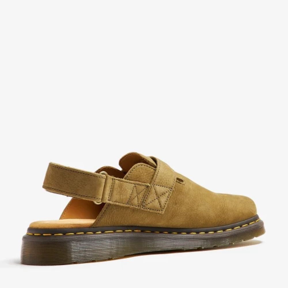 A side view of the Dr. Martens Jorge II slingback sandal in brown suede. The sandal features a chunky rubber sole with yellow stitching, a buckle strap, and a slingback strap.