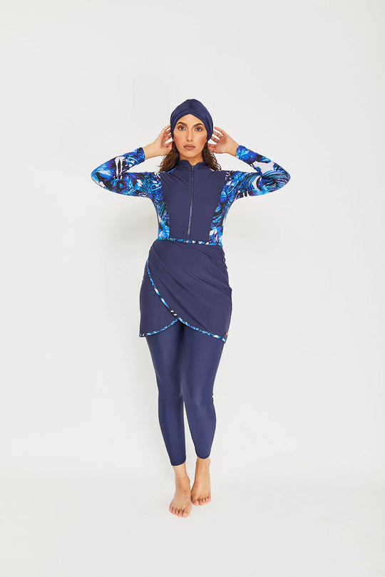 Model wearing sofia forest print in shades of blue with leggings and turban 