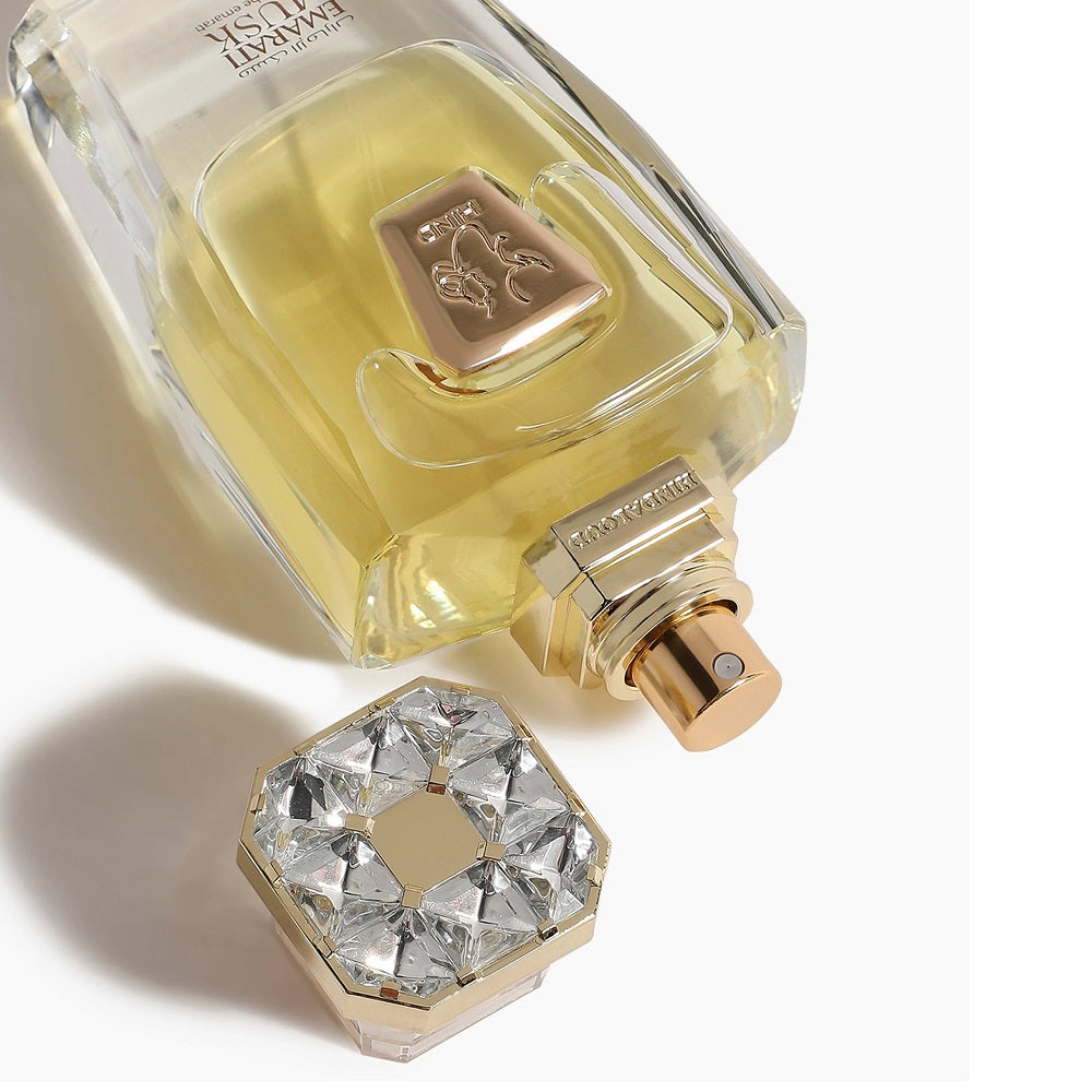 A 50mL Parfum bottle of Emarati Musk Parfum by Hind Al Oud laid down with its cap open