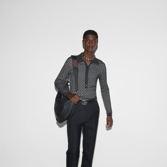 The GG shadow polo shirt effortlessly styled with a black satchel bag and trousers