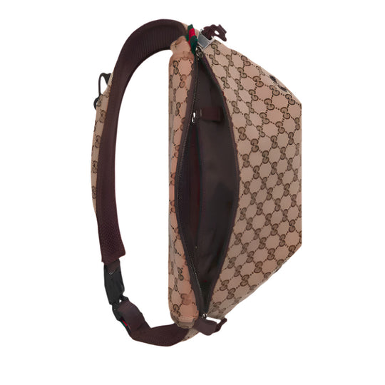 An open GUCCI Beige and dark brown GG Canvas Large Belt Bag with its beige and dark brown monogram, dark brown strap, and a glimpse of the red and green Web detail.