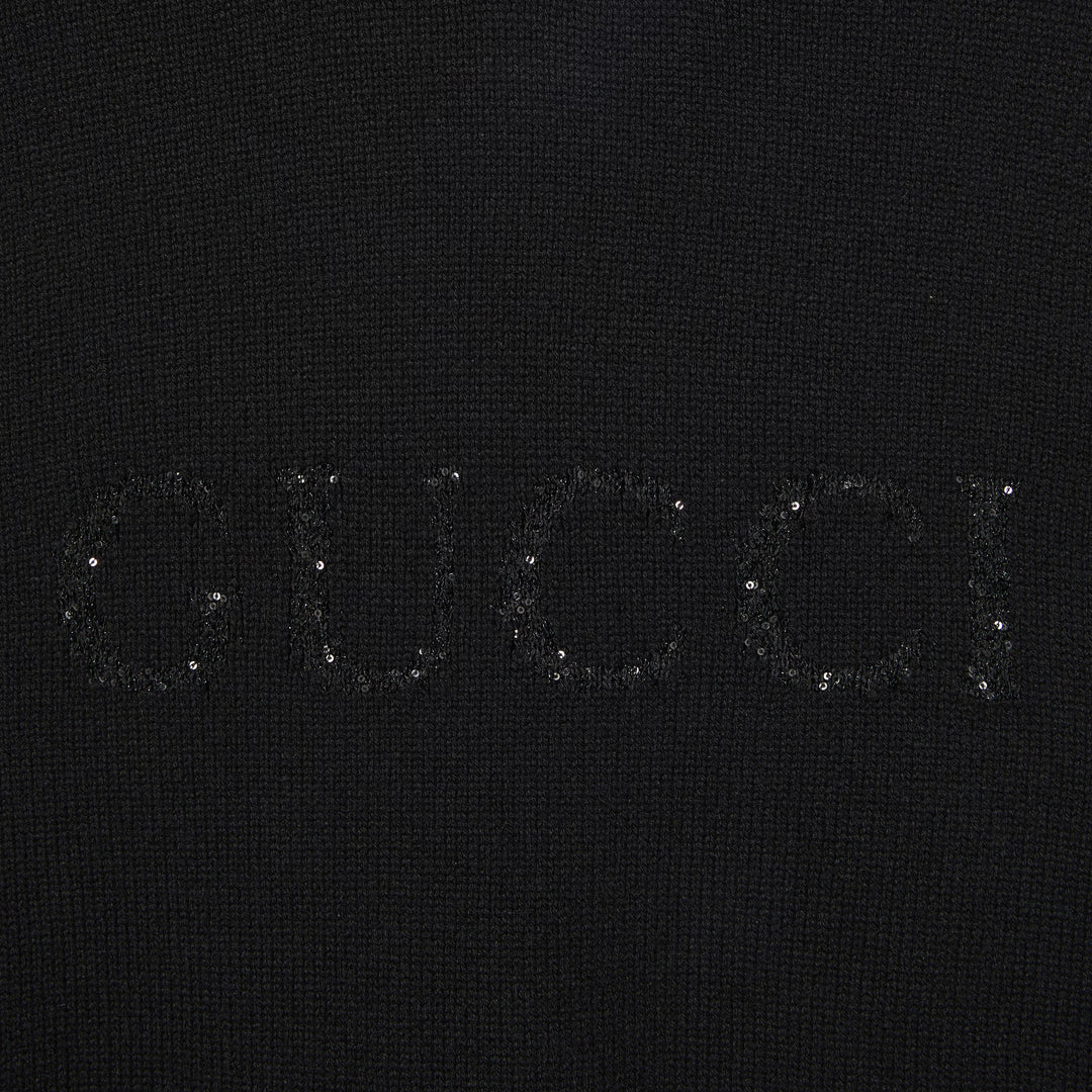 Close up view of the sequinned Gucci intarsia 