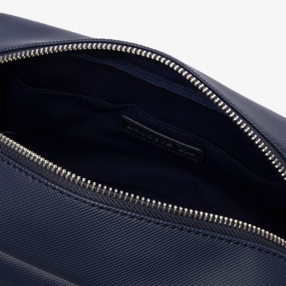 Close up of the Zip opening of LACOSTE Men's Classic Canvas Toiletry Bag