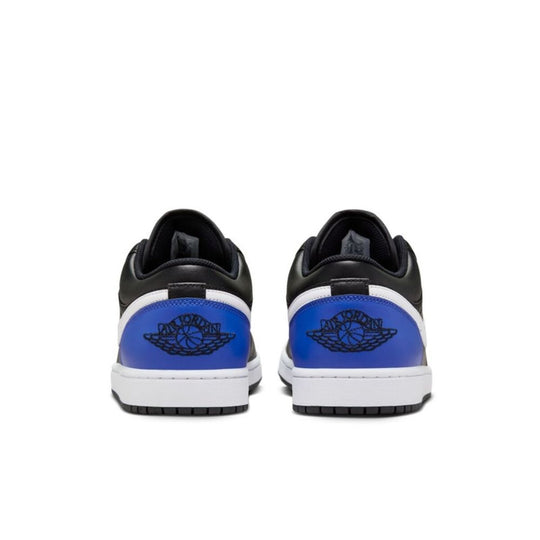 A pair of Men's AIR JORDAN 1 Low "Black Royal Toe" Sneakers