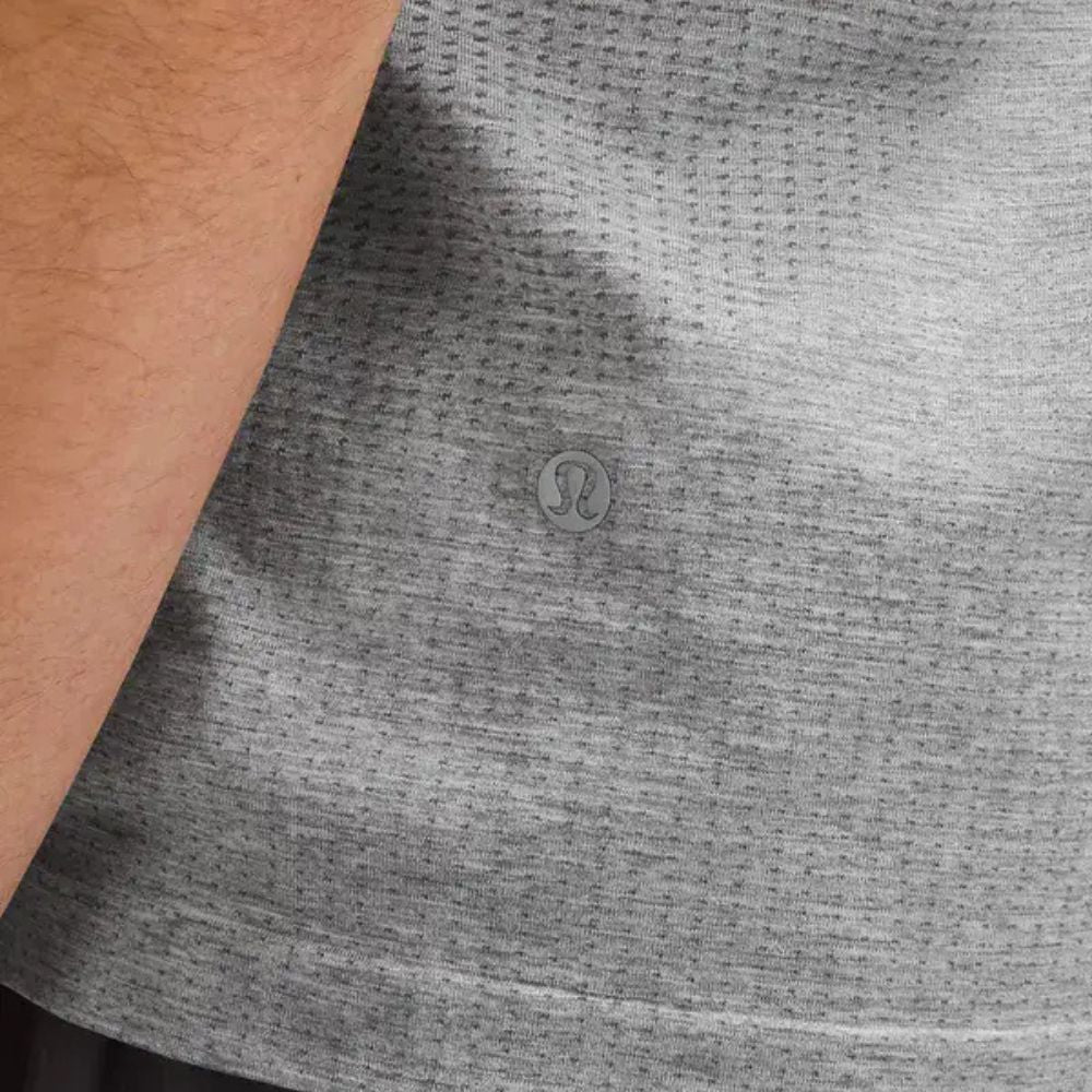 Close up image of hem of Metal Vent Tech Short Sleeve T-Shirt worn by a male model
