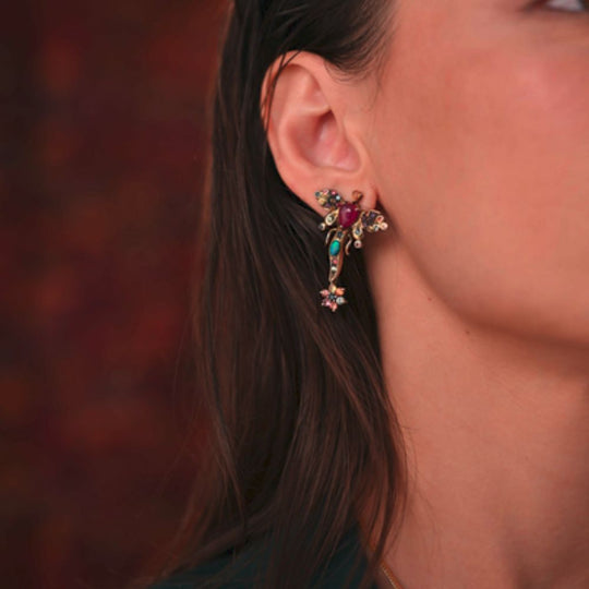 Close up of Moiseau Azure Opal Dragonfly Stud Earrings worn by a lady