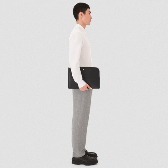 Side view of Person holding Montblanc Sartorial Black Saffiano Leather 13" Laptop Case