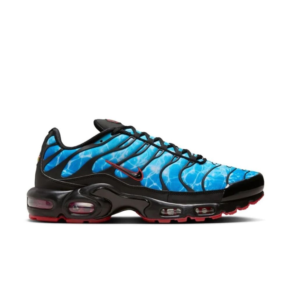 A side view of the Nike Air Max Plus "Shark Attack" sneakers, featuring a bold blue and black design with a red accent.