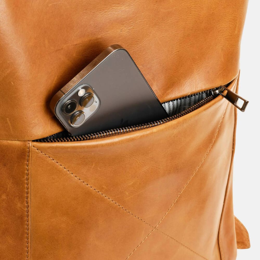 Smartphone in a brown leather pocket