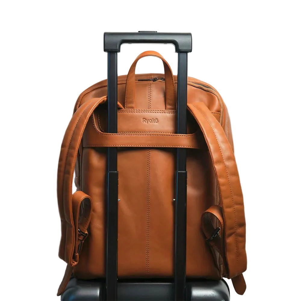 Brown leather backpack with wheels on a light gray background
