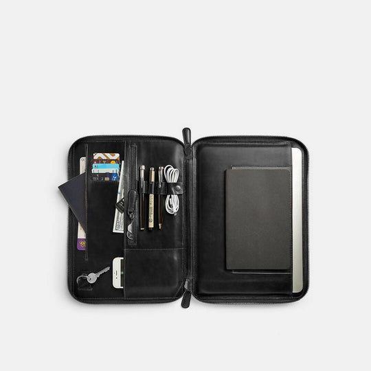 Black leather organizer with compartments on a white background