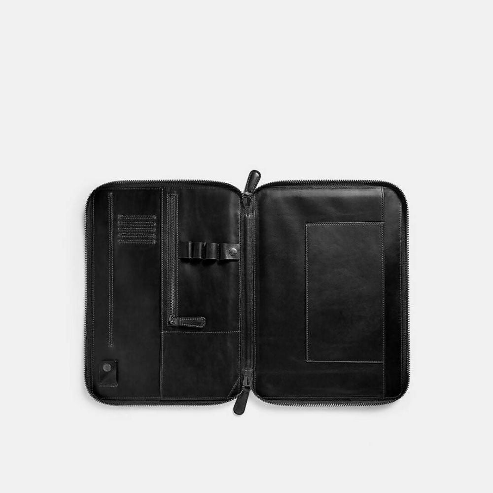 Black leather zippered case on a white background