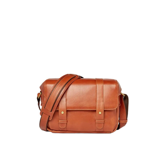 Brown leather bag on a white background