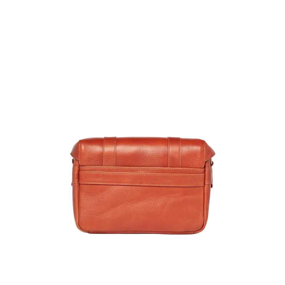 Brown leather bag on a white background