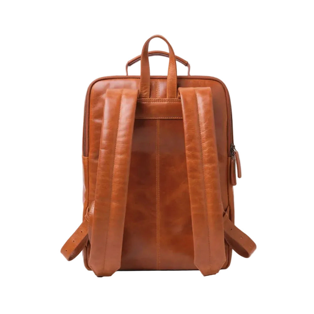 Brown leather backpack on a light gray background