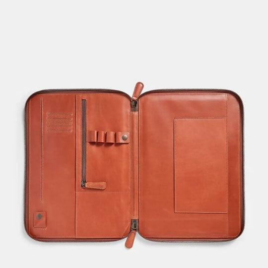 Caramel leather portfolio with zipper on a white background