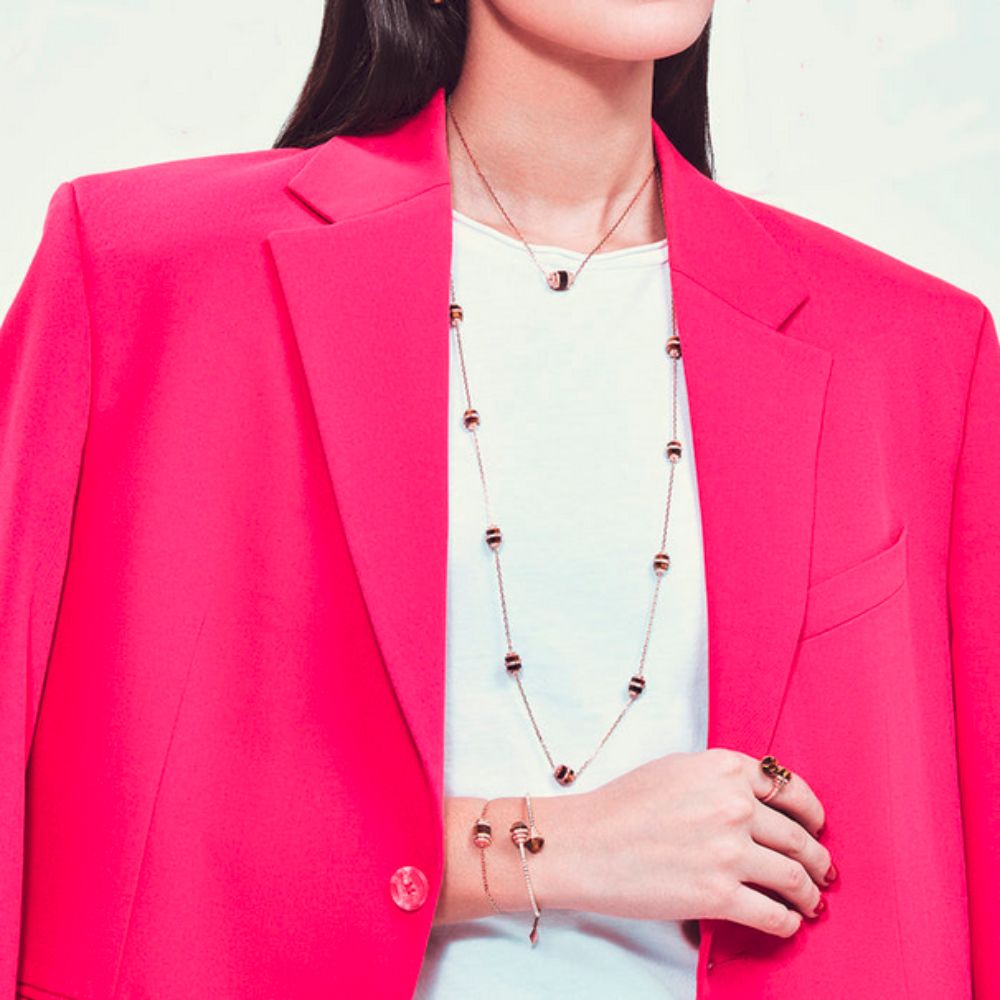 A model wearing Samra Azm Yellow Gold Tiger Eye Single Necklace