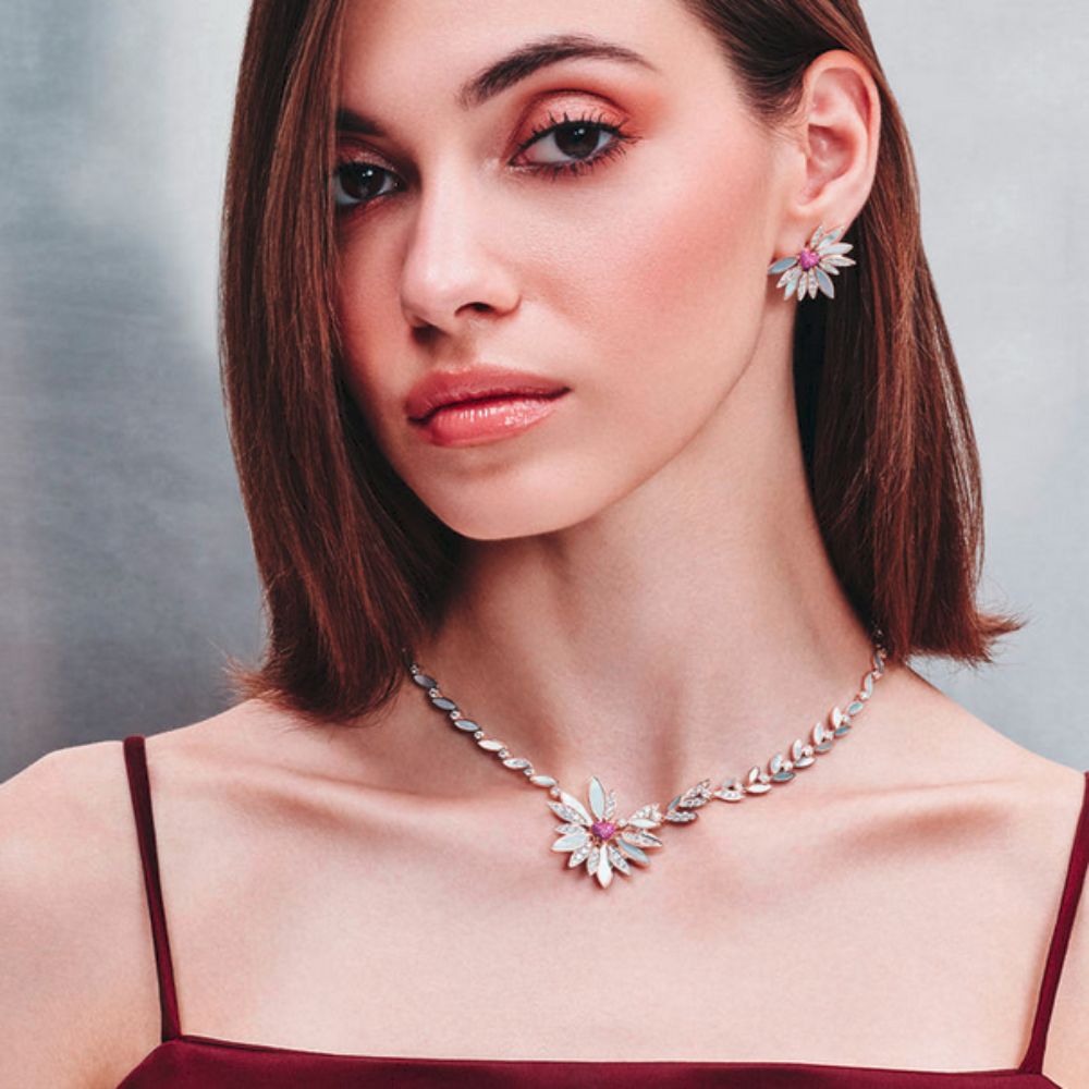 A model showing Samra Love Me Love Me Not Rose Gold Pink Sapphire Earring on her ear