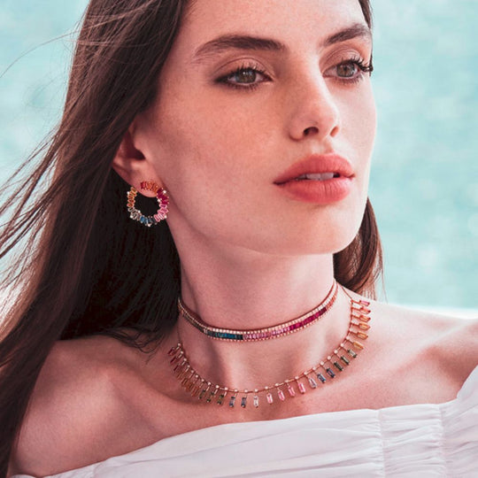 A model showing Samra Noor Rose Gold Sapphire Earring worn by her