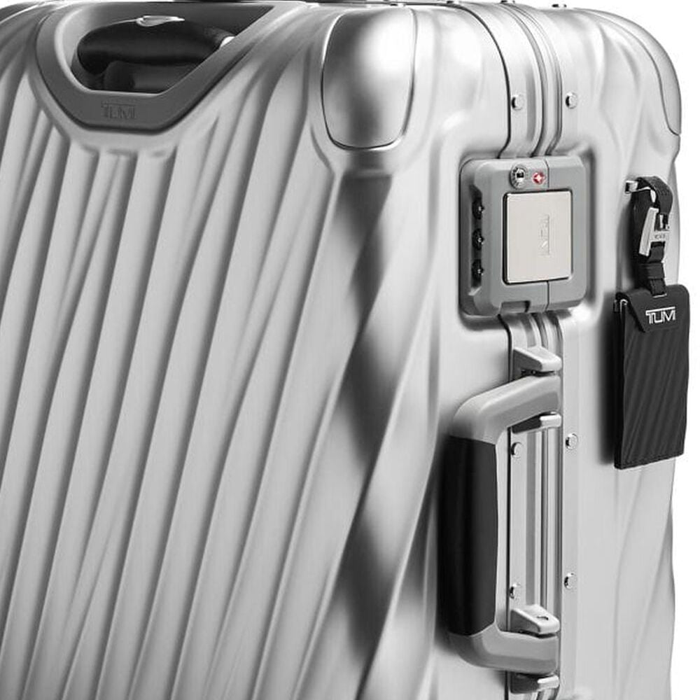 Close up of the combination lock and handle of TUMI Durable 19 Degree Aluminum Carry-On 98820-1776 in Silver